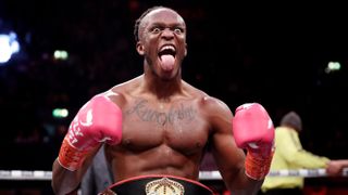 KSI celebrates beating an opponent by sticking his tongue out in the boxing ring ahead of the KSI vs Tyson Fury live stream.