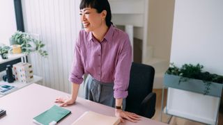 Woman standing at a desk