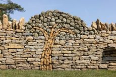 A tree of Hadspen stone, with leaves of Shaftesbury greenstone, grows amid a wall of forest marble. Credit: Millie Pilkington for Country Life