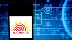 The Aadhaar logo on a smartphone