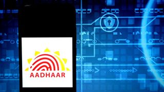 The Aadhaar logo on a smartphone