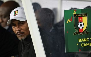Cameroon AFCON 2023 squad: Rigobert Song sitting in the Cameroon dugout as they face Senegal