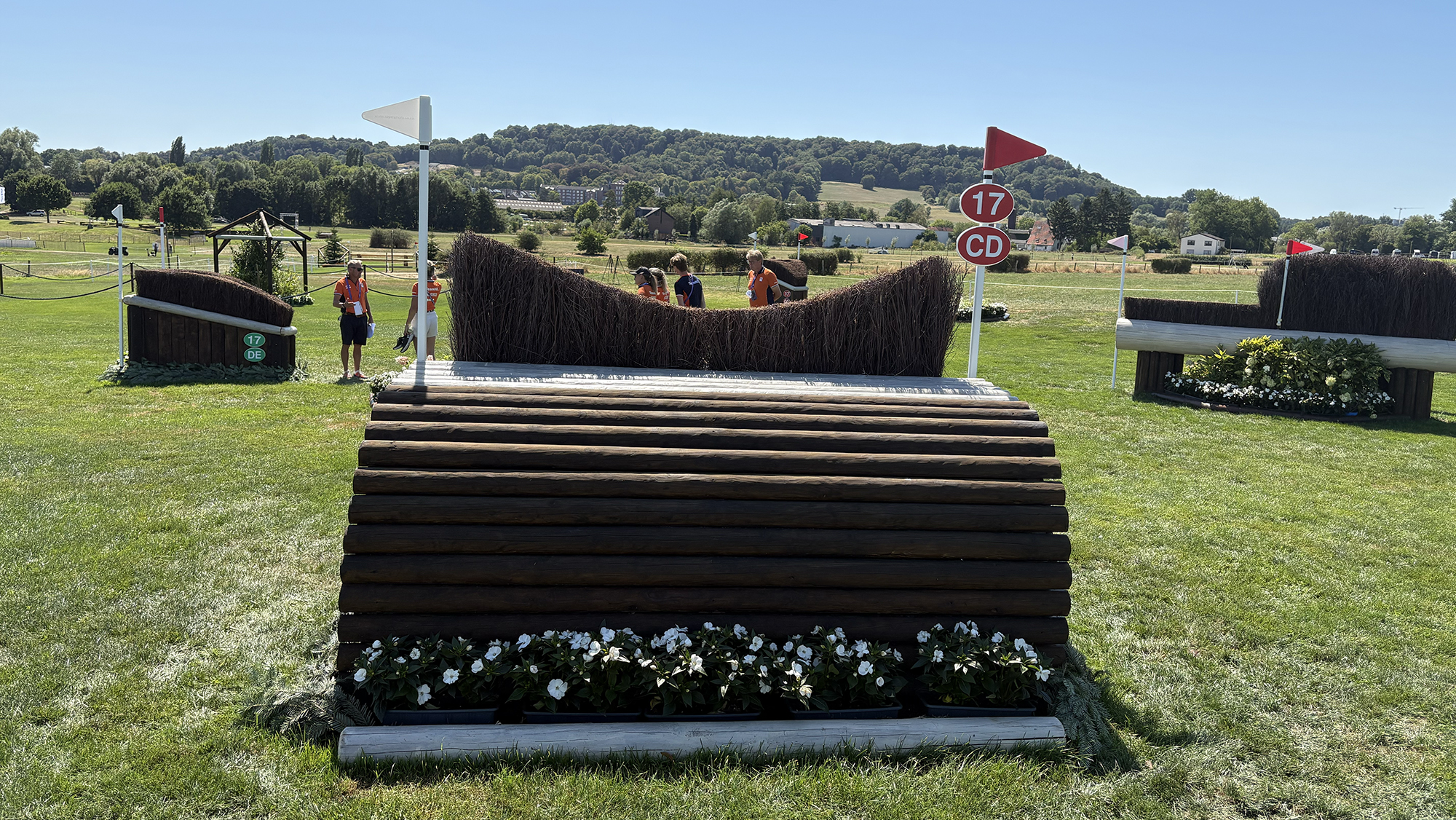 A wooden rolltop fence topped with brush on the eventing World Championships cross-country course