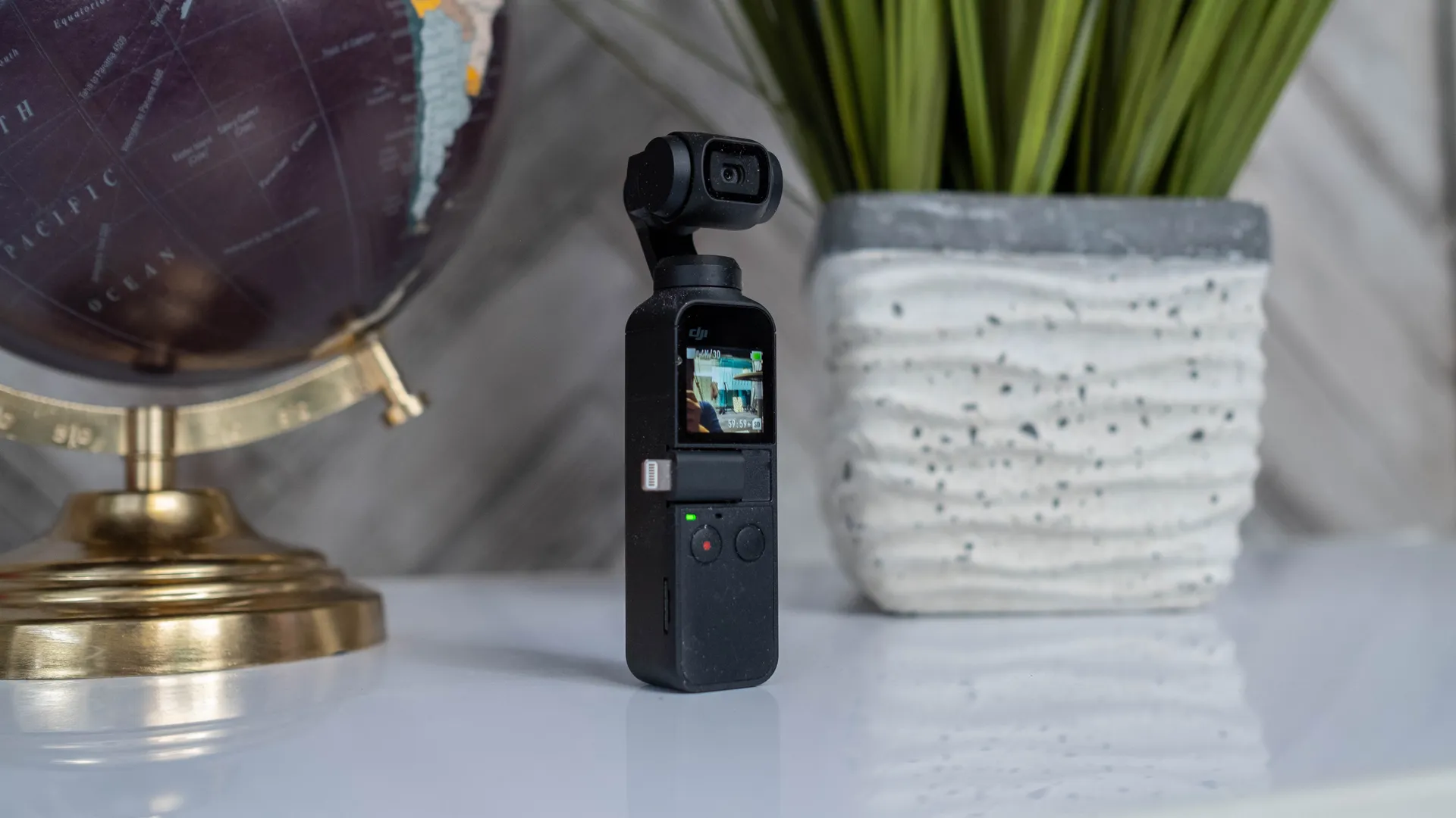 DJI Osmo Pocket on a table filming the room