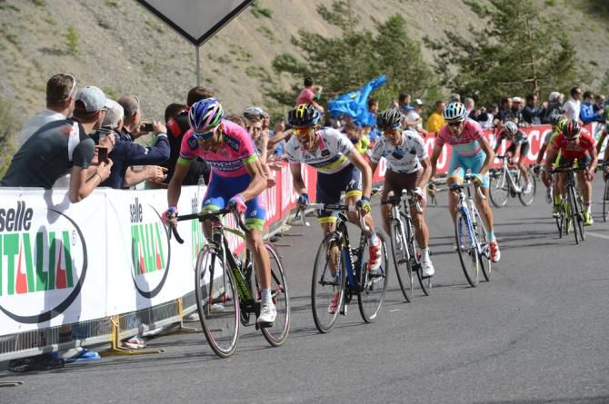 Michele Scarponi (Lampre-Merida) sets the pace as the maglia rosa group nears the finish line