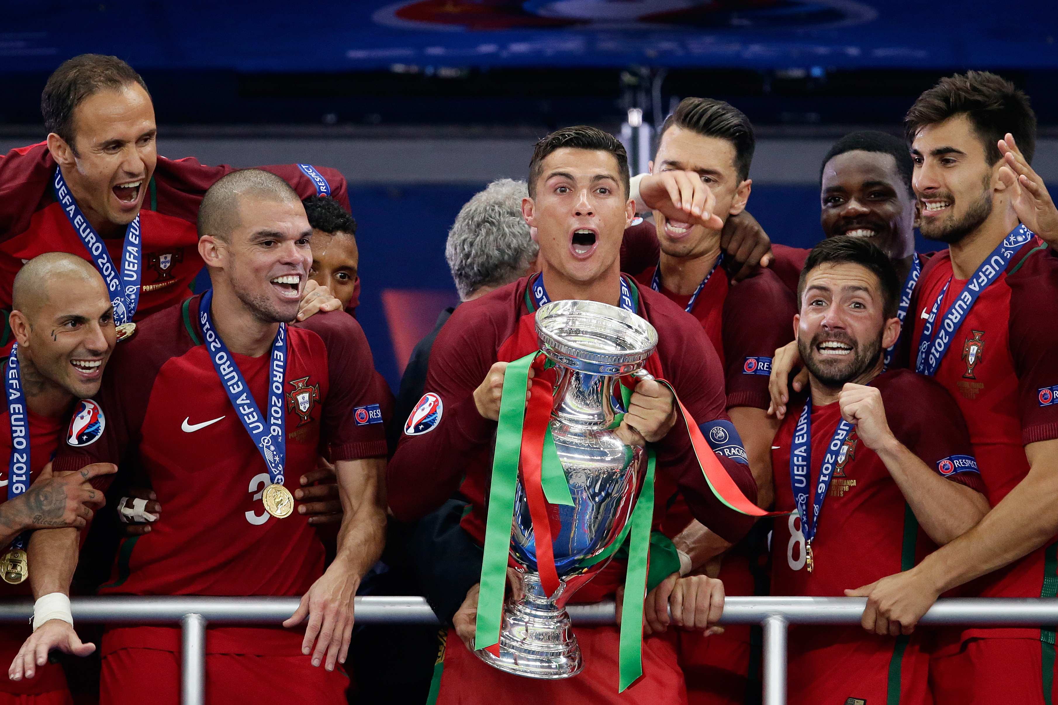 Cristiano Ronaldo celebrates with the European championship trophy alongside his Portugal team-mates after victory over France in the final of Euro 2016.