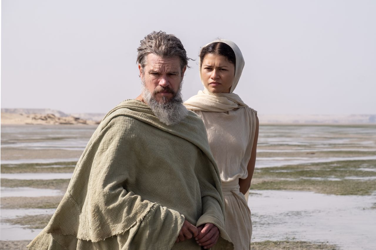 A series of set shots of actors dressed in period clothing, filming along rugged coasts, tranquil sandy beaches, and rocky fortresses.