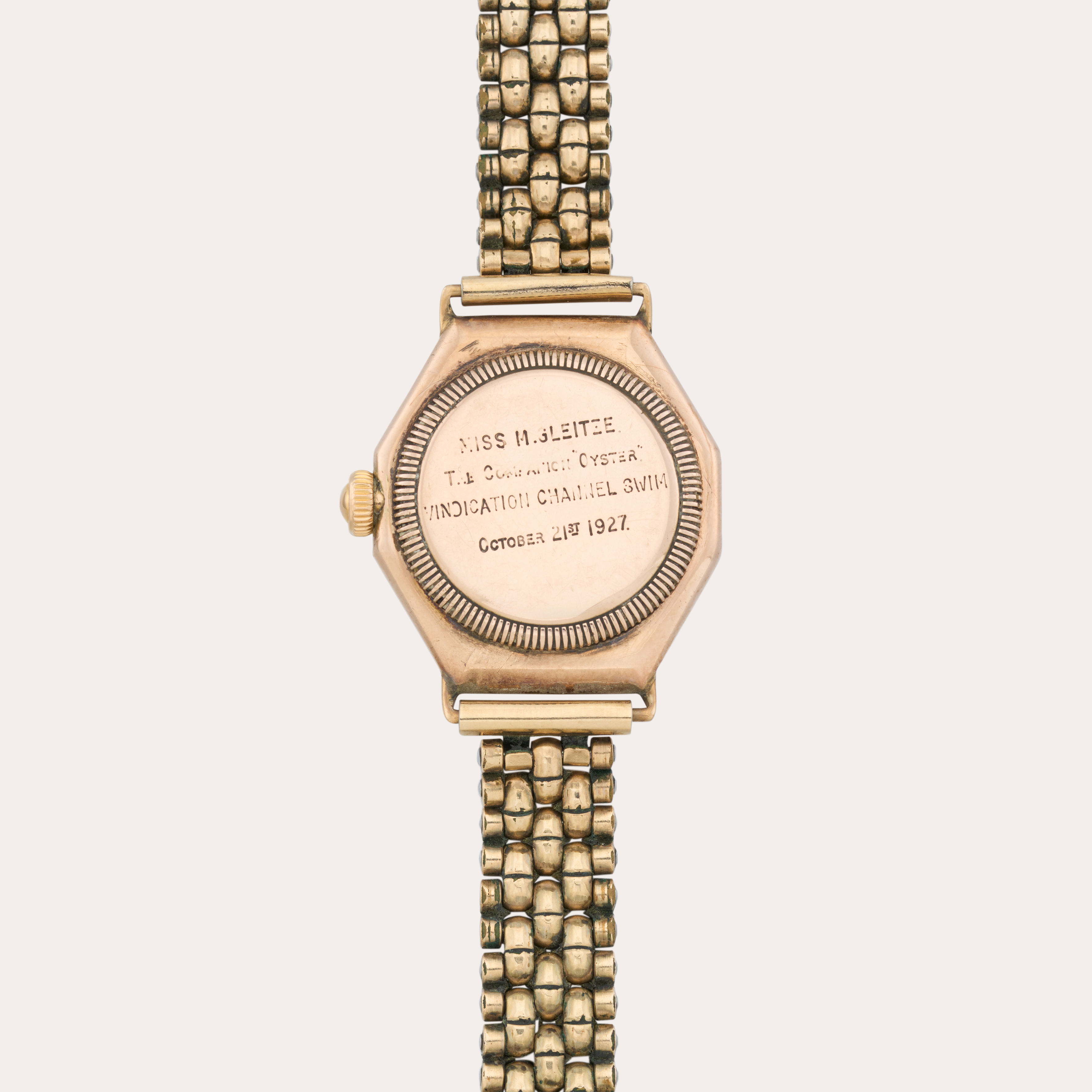 Gold Rolex Oyster watch on gold chain