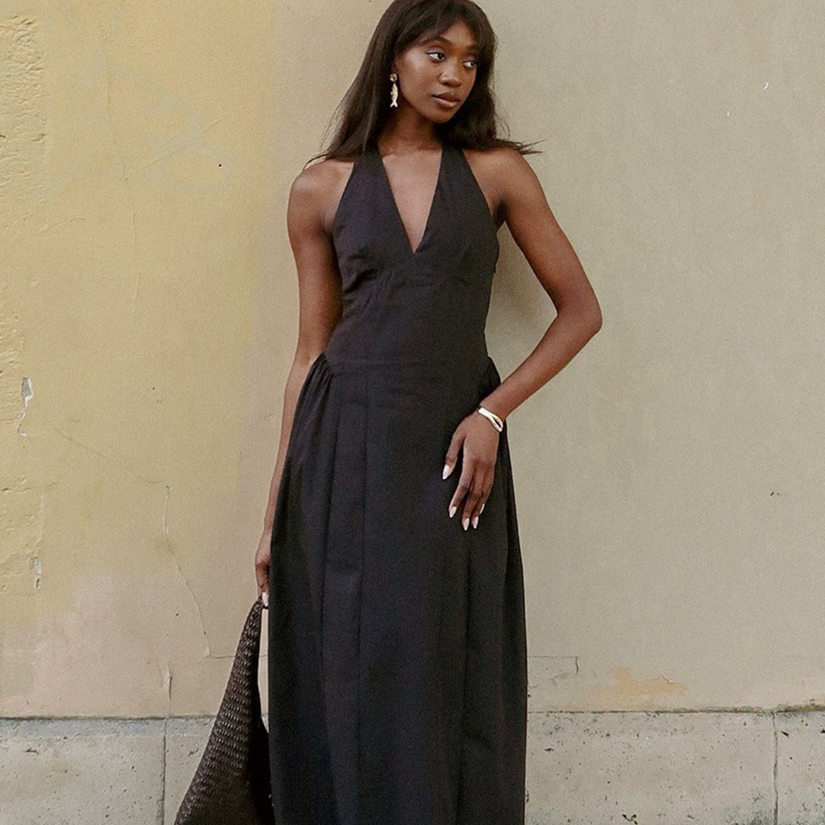 Woman in black halter dress