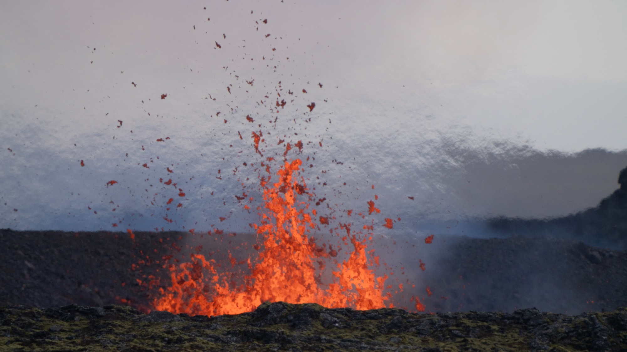 Molten lava is seen coming out of a fissure on the outskirts of the fishing village Grindavik in southwest Iceland