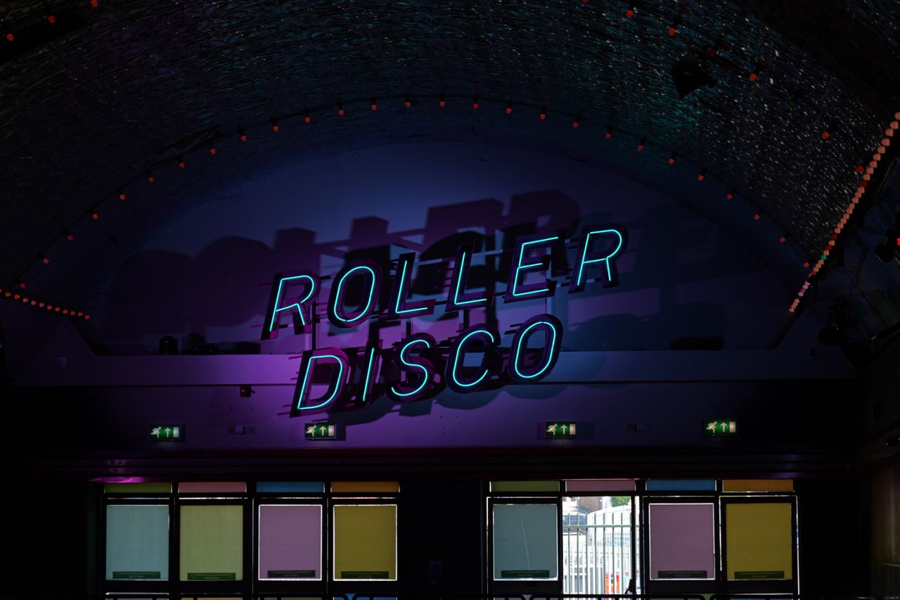 A reading roller disco in neon