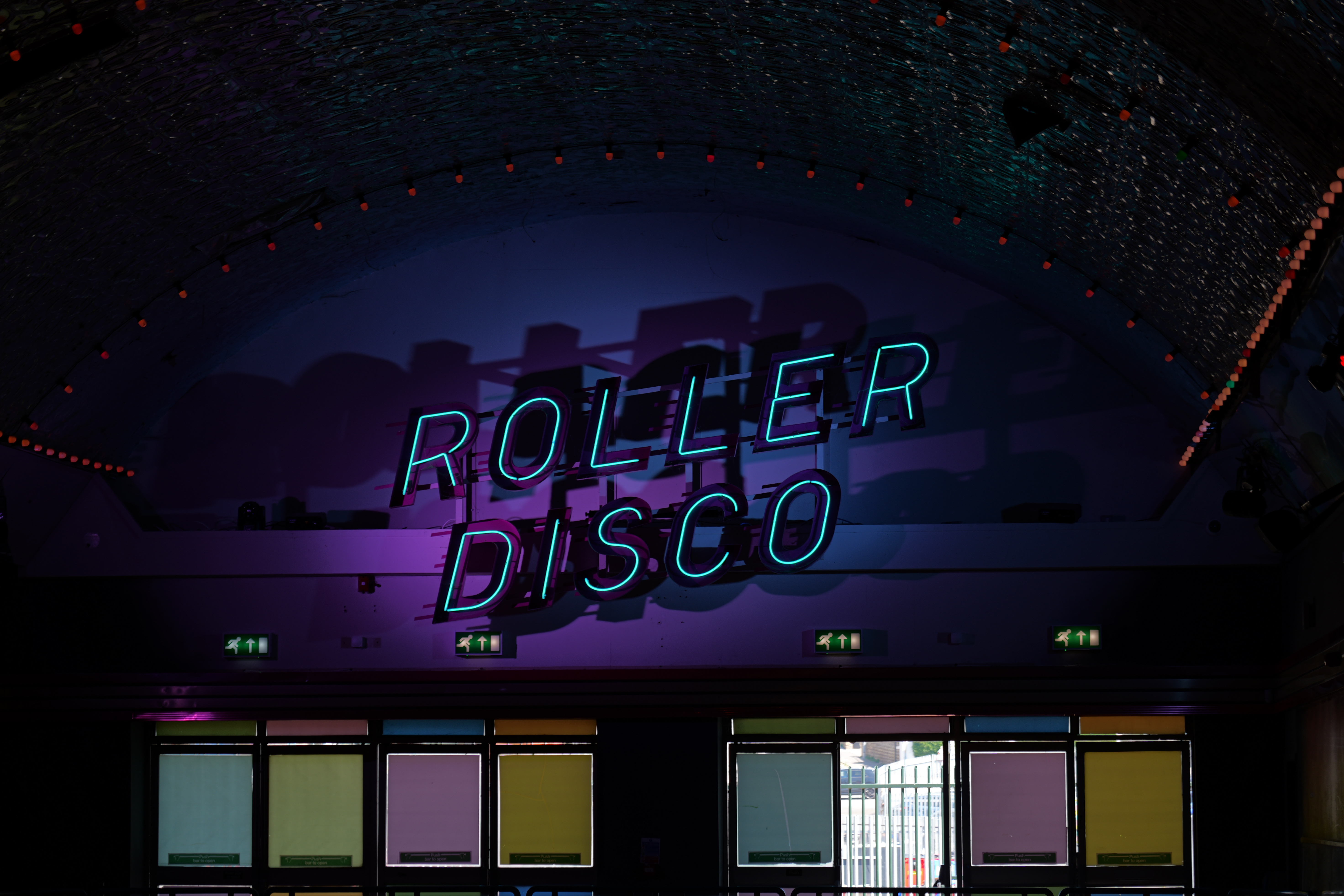 A reading roller disco in neon