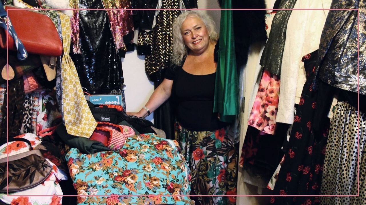 A photo of Mandi Simms surrounded by clothing in a room of her home crammed full of posessions, from the TV show Hoarders