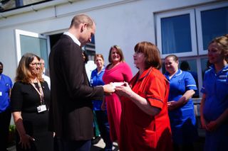 Prince William, Prince of Wales, known as the Duke of Cornwall when in Cornwall, speaks to Lynda McHale during a visit to St. Mary's Community Hospital, Isles of Scilly, to meet staff and hear about a new integrated health and social care facility which is set to be built on adjacent land owned by the Duchy of Cornwall on May 10, 2024 in Isles of Scilly, England.