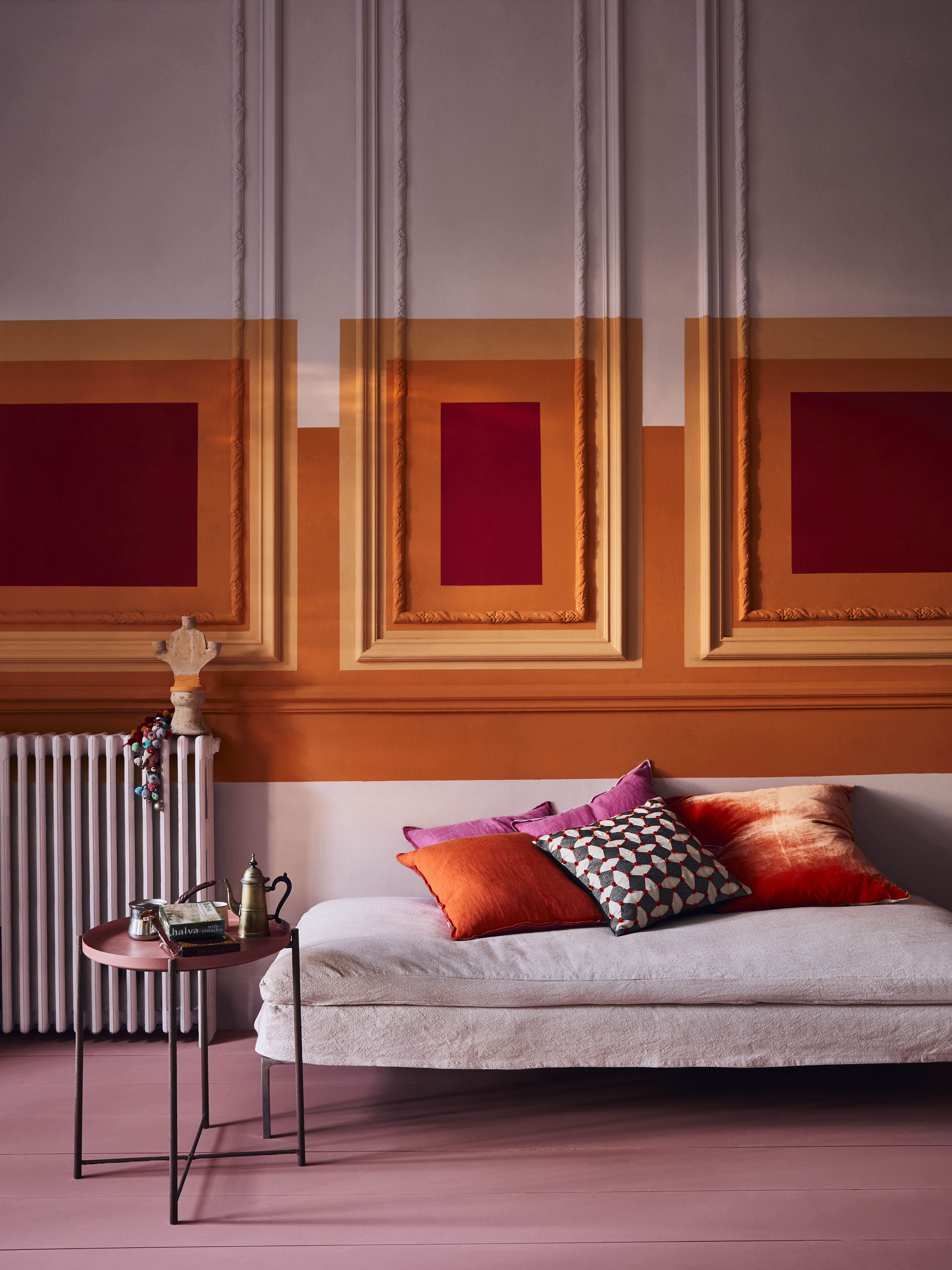 Living room with boldly painted wall panelling