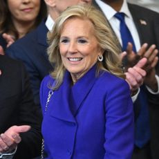 Jill Biden waering a blue-purple coat to the inauguration