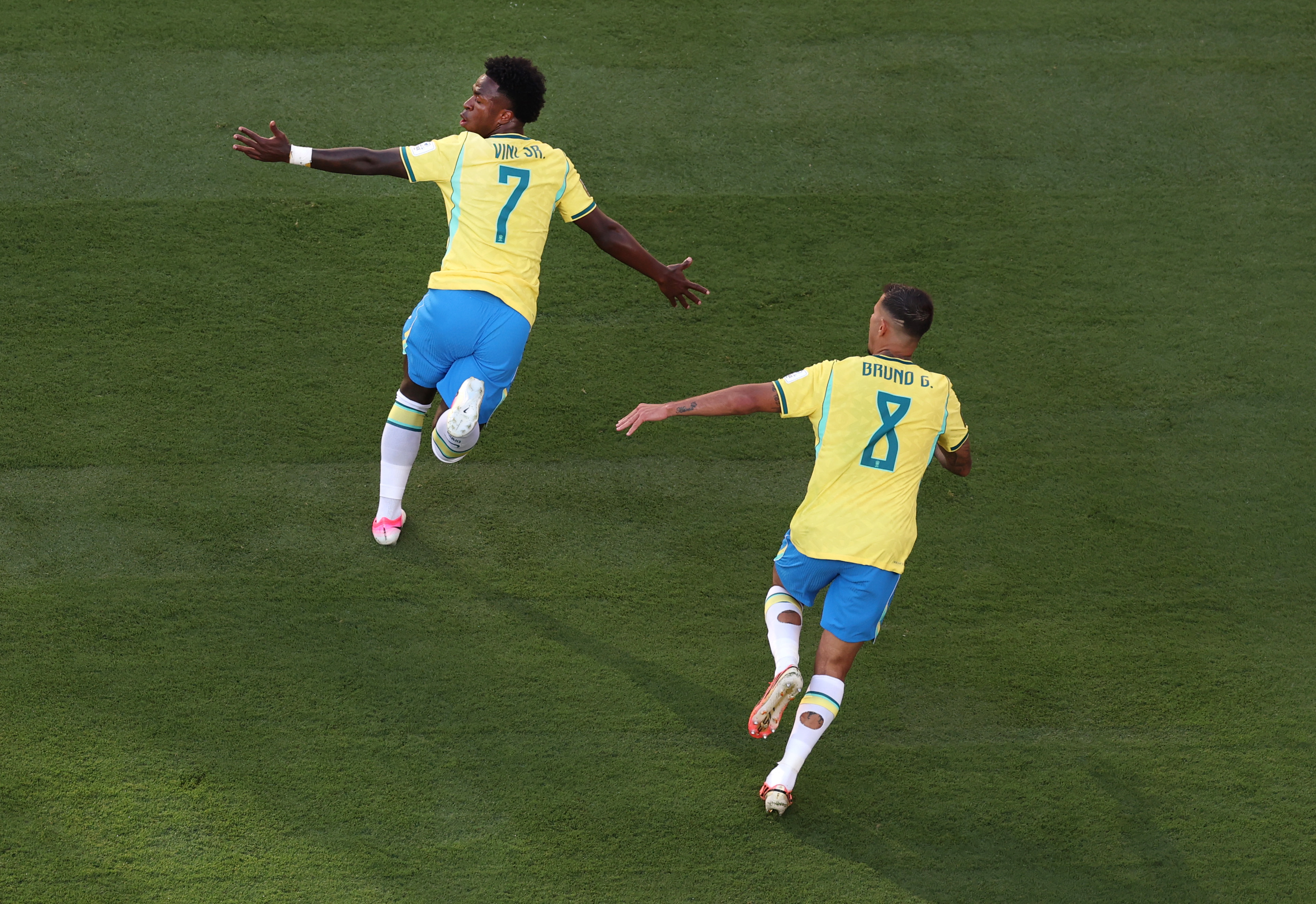 Arsenal targets Vinicius Junior of Brazil celebrates with Bruno Guimaraes after scoring the team's first goal against Morocco