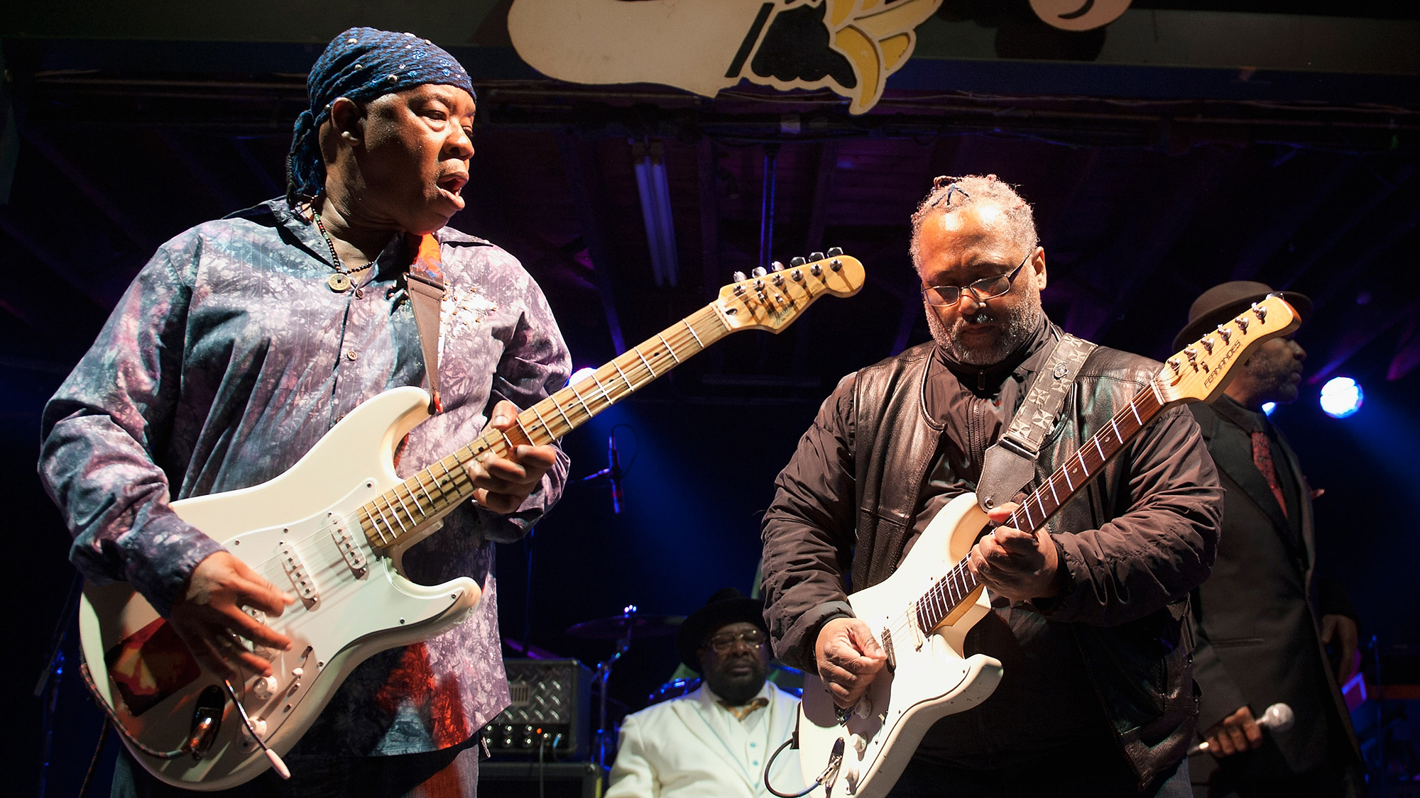 Goerge Clinton (C) and Michael Hampton (R) of George Clinton and Parliament Funkadelic perform at Tipitina's on December 29, 2012 in New Orleans, Louisiana