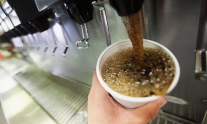 A customer fills a 32-ounce soda at a Manhattan McDonald's