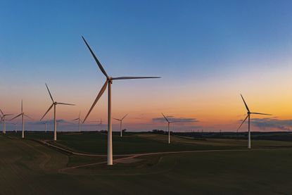 Drone view of a wind farm. Multiple wind turbines 