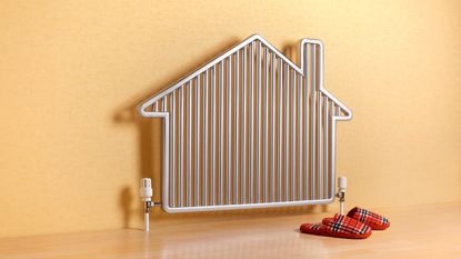House shaped radiator with slippers—stock photo.