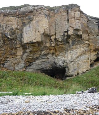 Ancient human remains have been found at Sculptor's Cave and other sea-caves around Scotland's North Sea coast at Moray.