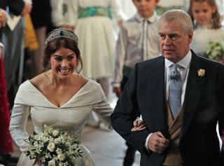 WINDSOR, ENGLAND - OCTOBER 12: Princess Eugenie of York arrives with her father Prince Andrew, Duke of York, ahead of her wedding to Mr. Jack Brooksbank at St. George's Chapel on October 12,
