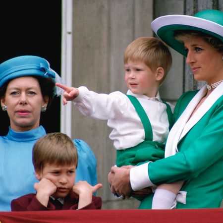 Princess Margaret wears a turquoise blue outfit and stands on Buckingham Palace balcony with Prince William, and Prince Harry and Princess Diana, who wear matching green and white outfits