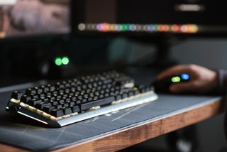 PC gaming keyboard on desk with mouse