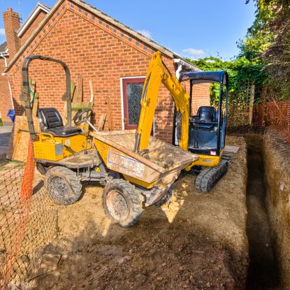 Excavating trenches for extension foundations
