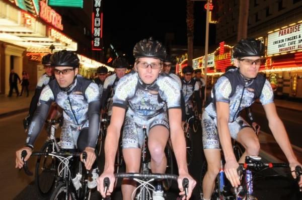 The Adageo Energy Pro Cycling Team takes to the streets at night.