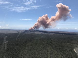 A plume of ash shoots into the air after a magnitude-5.0 earthquake shakes Hawaii's Kilauea south of the Pu'u 'Ō'ō crater floor on Thursday (May 3).