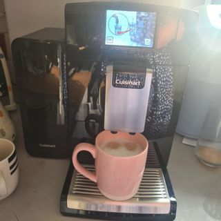 Cuisinart Veloce coffee machine with mug of coffee