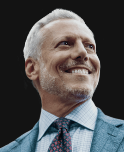 a white man with gray hair in a suit and tie