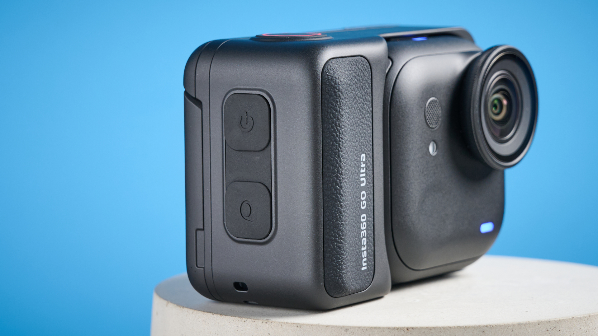 Insta360 Go Ultra against a blue background