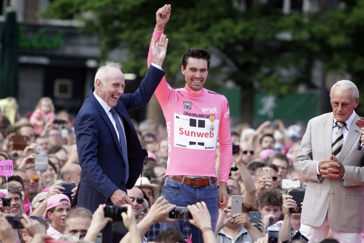 Joop Zoetemelk holds aloft Tom Dumoulin's hand