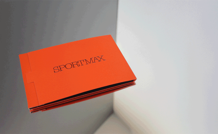 Fashion Week Invitation gif image showing a red book that passes through pages with a word on each.
