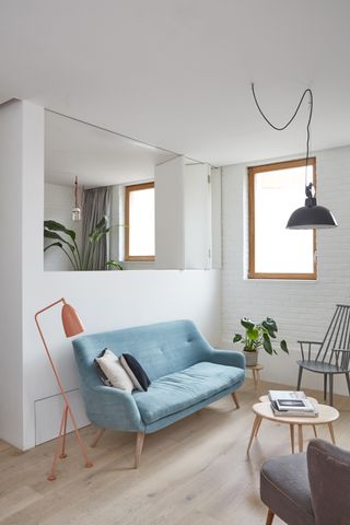 a small living room with a folding internal window