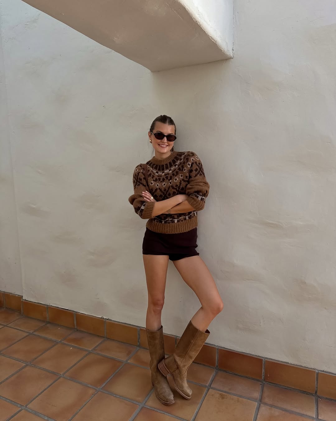 Sara Walker in a Fair Isle sweater and black spandex.