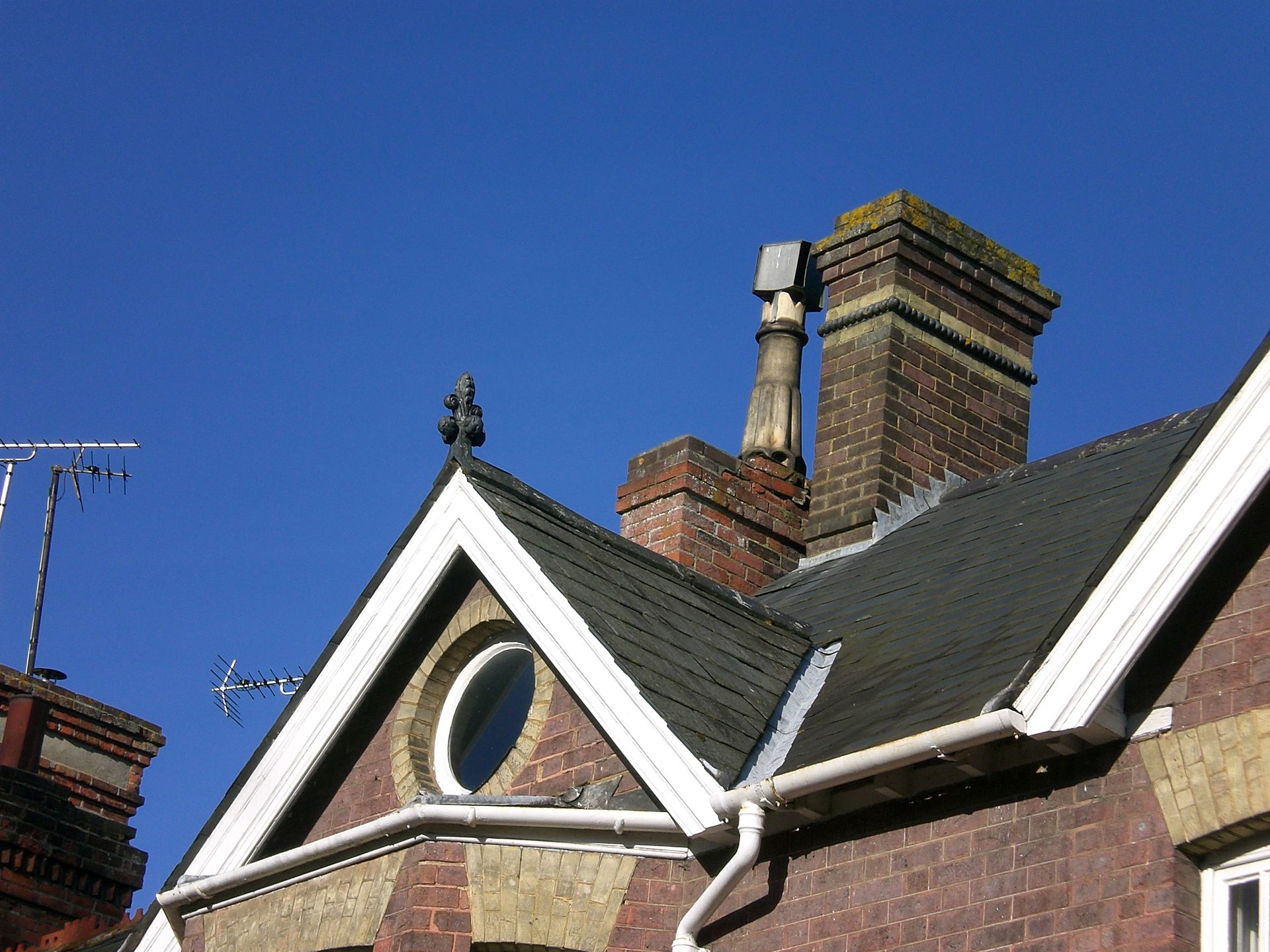 classic lead lined valley on victorian roof, against a blue sky
