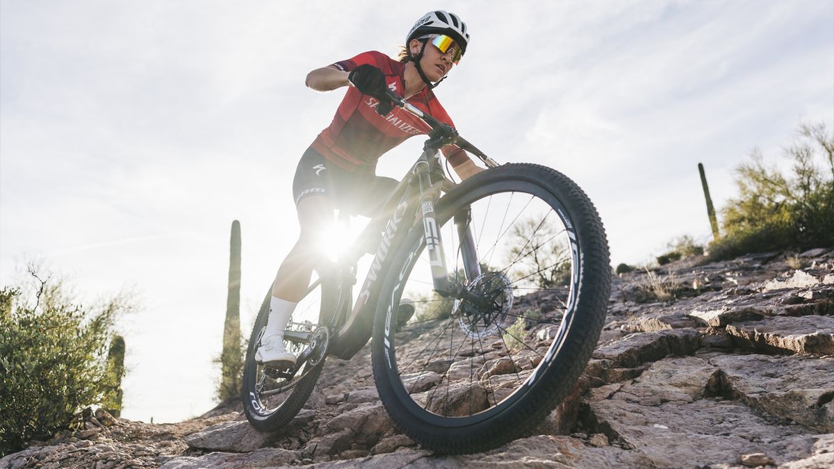 Mountain biker rides down a rocky trail using RockShox&#039;s new Flight Attendant