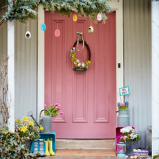 easter decoration with pink door and plants