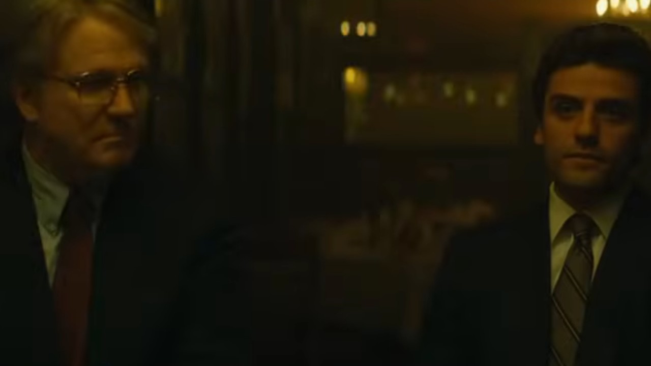 Albert Brooks sitting beside Oscar Isaac in A Most Violent Year