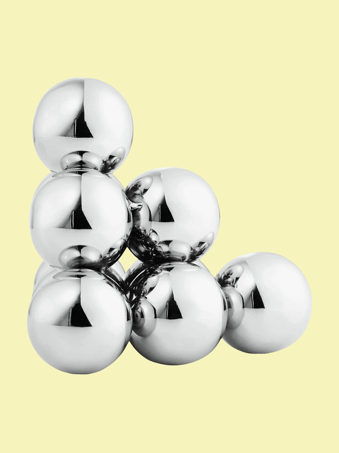 A chrome stacked orb bookend
