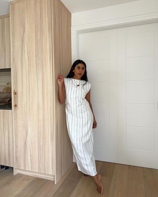 @monikh wearing a striped dress