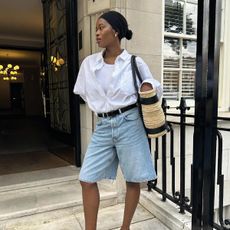 an influencer wearing relaxed denim shorts and a white shirt