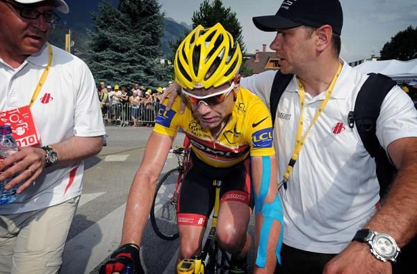 Cadel Evans is assisted by BMC staff after finishing stage 9.