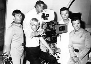 Actors Leonard Nimoy, DeForest Kelley and William Shatner pose for a portrait with writer Gene Roddenberry and director Robert Wise during the filming of the movie "Star Trek: The Motion Picture" which was released Dec. 27, 1979.