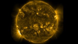 NASA's Solar Dynamics Observatory captured the solar flare May 3, 2022, which is visible at lower left.