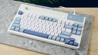 A blue and white Epomaker DynaTab75 wireless mechanical keyboard
